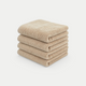 Stapel van vier zachte beige handdoeken van DOUXE