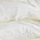 Detail steg van hotel dekbed voor de winter van 90% dons